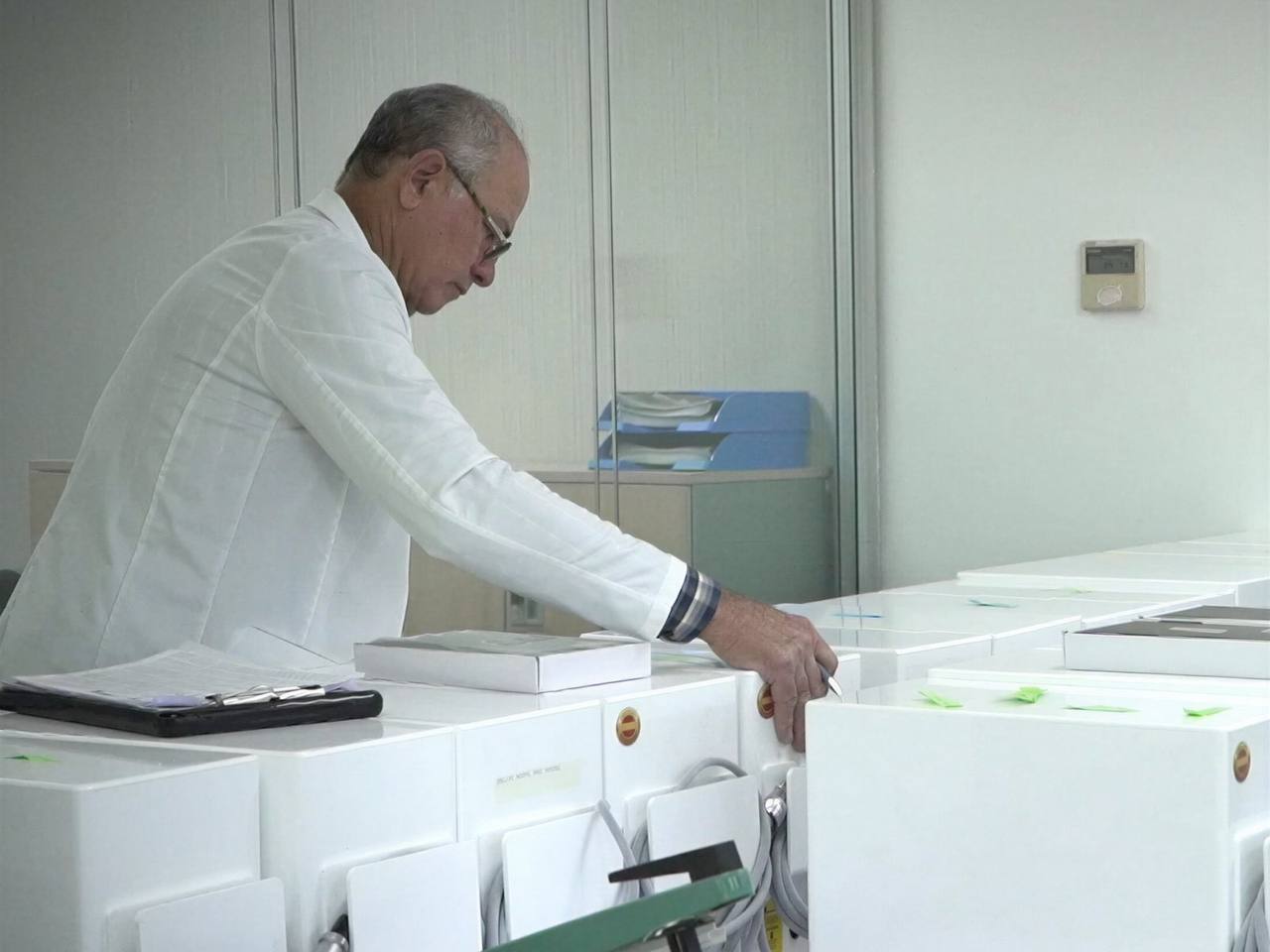 Technician assembling and testing devices at the factory
